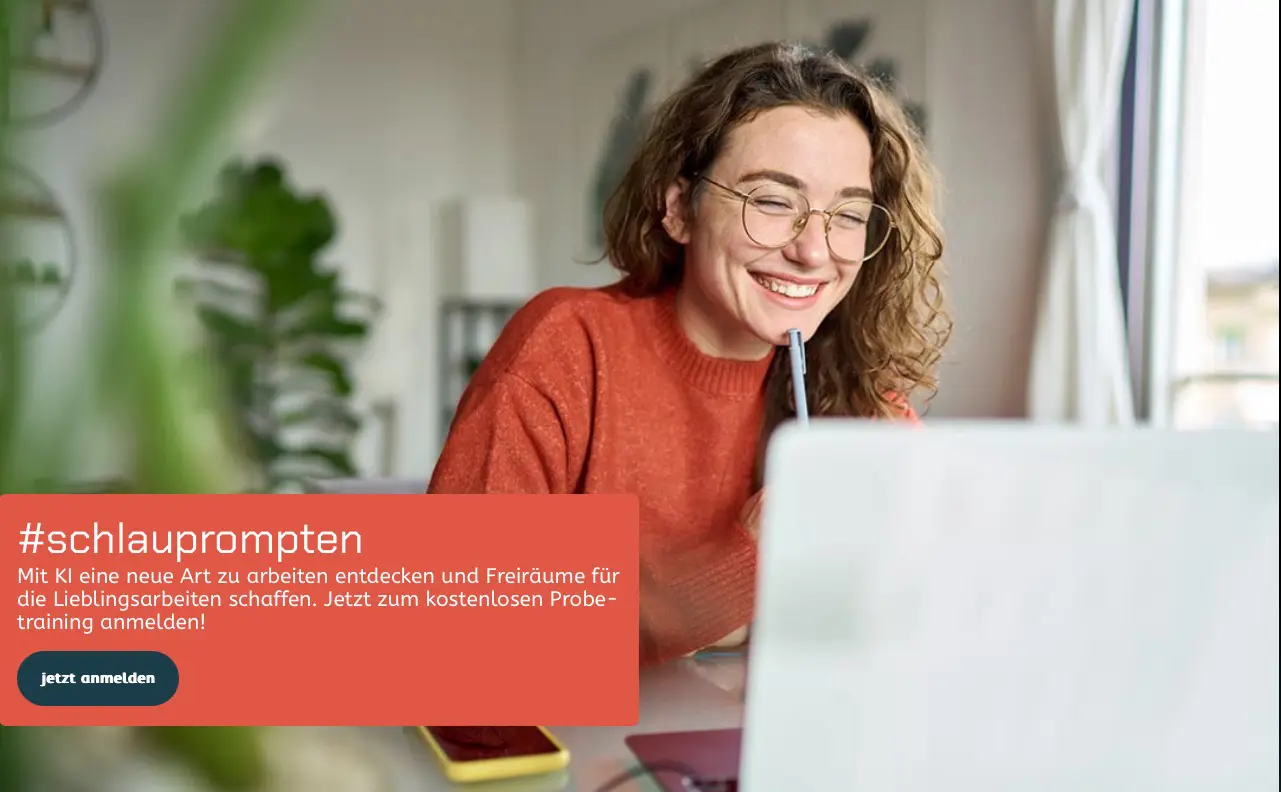 Woman in orange sweater working on laptop with smile